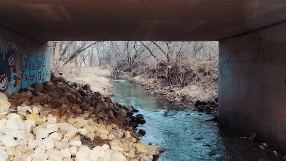 View through a rural mountainside bridge in the springtime