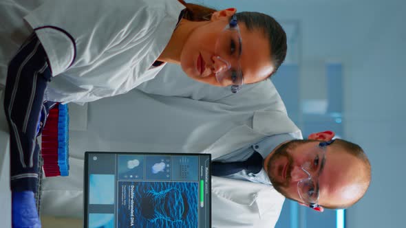 Vertical Video Team of Scientists Sitting in Laboratory Looking at Camera