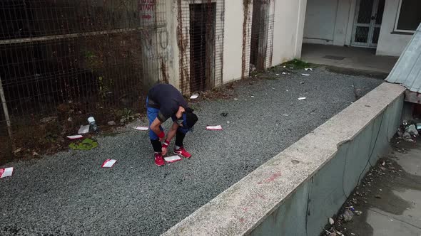 Parkour Free Runner Making Adjustments Before Doing a Flip over a Ledge.