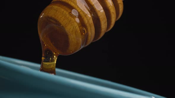 Honey Pouring From Honey Spoon