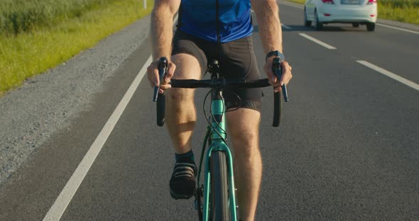 Bicyclist's Hands on the Steering Wheel