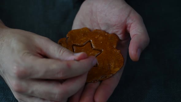 Men's Hands Closeup Scratch and Break Brown Sugar Caramel Candy