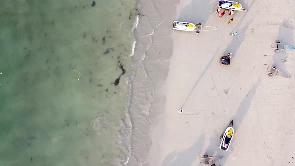 Amazing Aerial Downward View of Beautiful Tropical Beach with Tourists