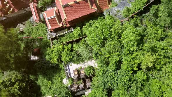 Drone Flies Over Beautiful Buddhist Temple and Old Cemetery