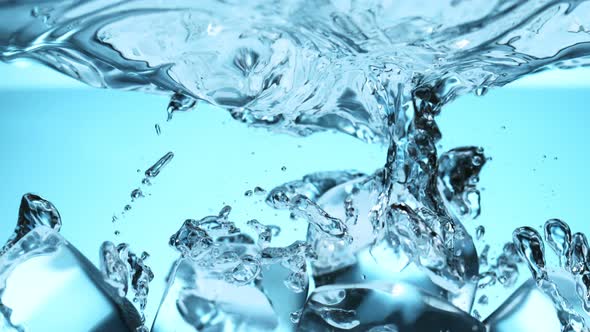 Super Slow Motion Shot of Clear Ice Cubes Falling Into Water at 1000Fps