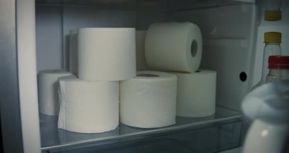 Open the fridge door. Panic purchases of toilet paper are already stored in the refrigerator. Pandem