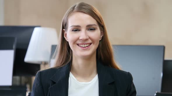 Portrait of Smiling Woman in Office