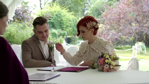 Newly Made Bride Sign Marriage Agreement Ceremony with Beautiful Redhair