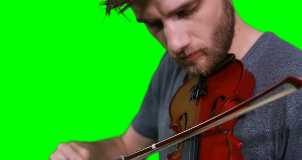 Close-up of male musician playing violin