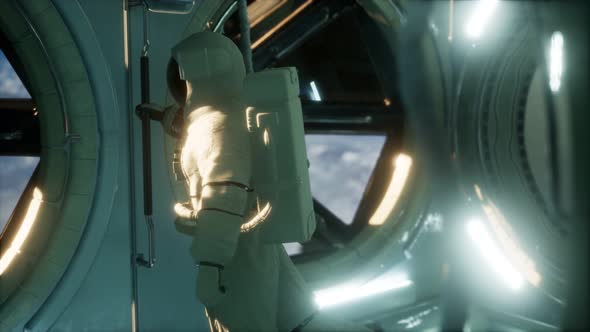 Astronaut Inside the Orbital Space Station