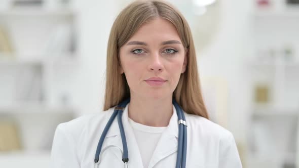 Portrait of Young Doctor Saying No with Finger Sign