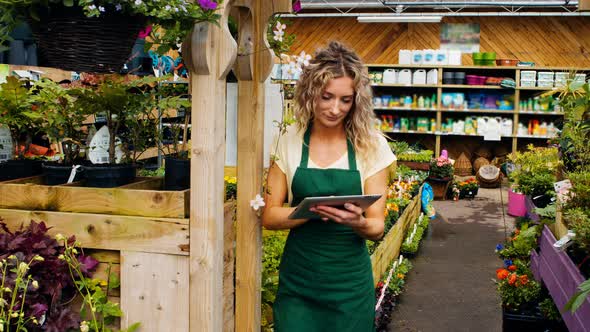 Female florist using digital tablet