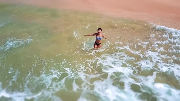 Asian Woman Feet Walking Barefoot Beach at Endless Ocean Seaside Leaving Footprints in Sand