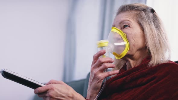 Elderly Lonely Woman Using Inhaler While Watching Tv