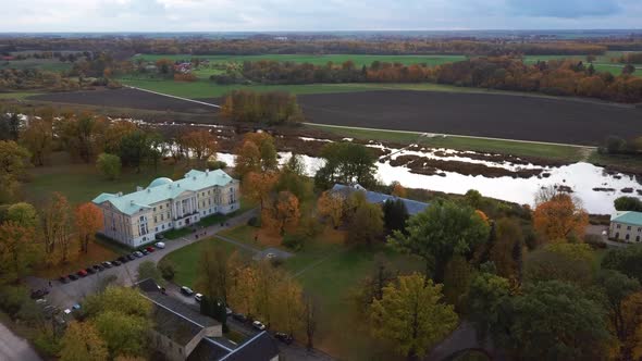 Autumn Aerial Landscape of the City Mezotne and Palace With Park Near Lielupe River, Latvia 4K Video