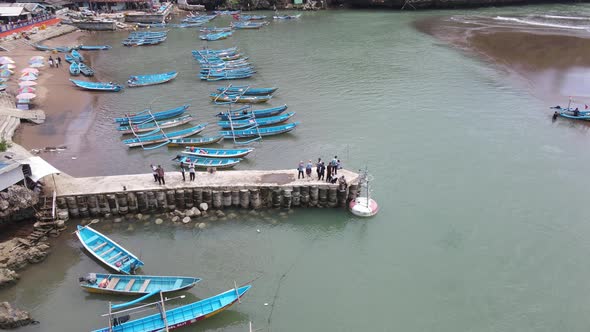 Aerial view of traditional boats in lagoon beach in Indonesia