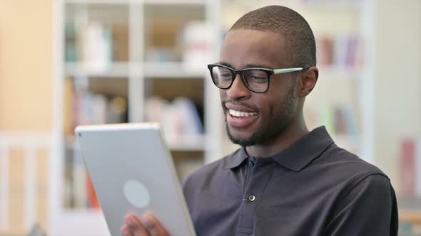 Portrait of Video Chat on Tablet By African Man