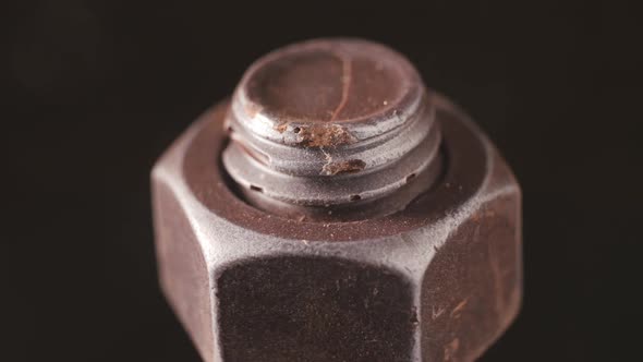 Chrome Metal Bolt and Nut Rotate in Closeup