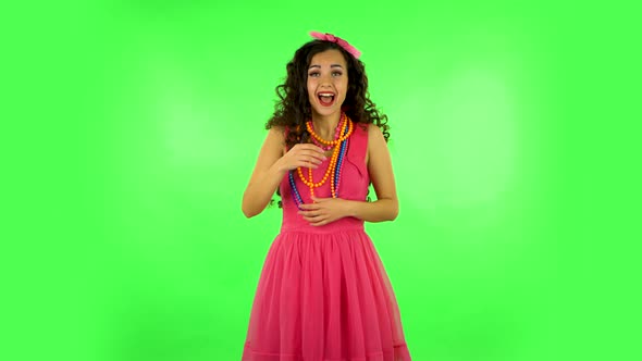 Girl Cute Laughing Against Green Screen at Studio