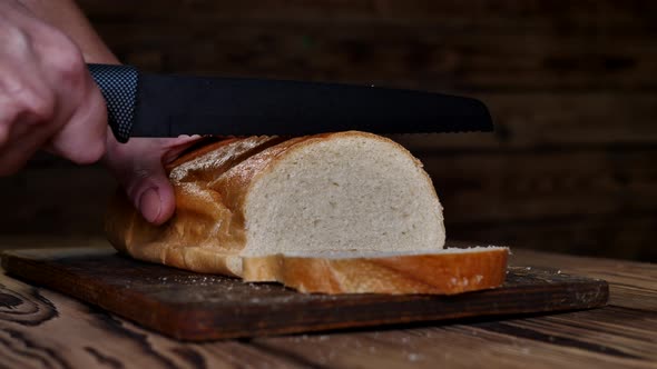 Cutting Fresh Wheat Bread with a Special Knife