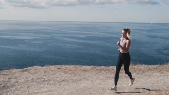 Backside View of Woman Running Outdoors, Beautiful View on Ocean, Slow Motion