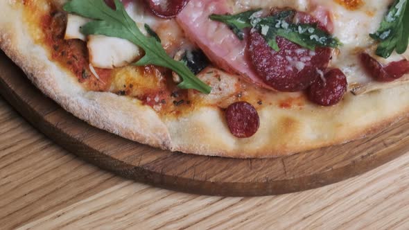 Appetizing Pizza on a Wooden Board in a Restaurant