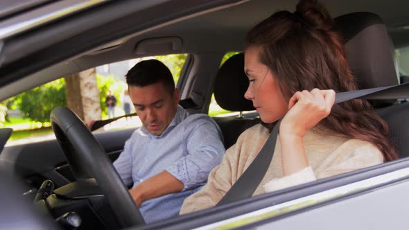 Car Driving School Instructor Teaching Woman