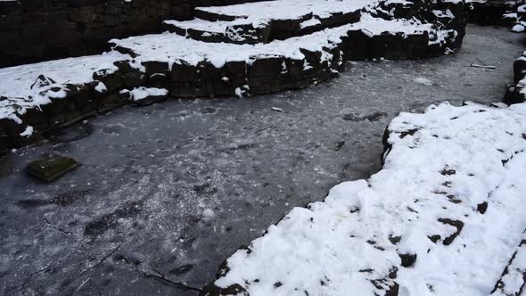 Frozen pond in winter park.