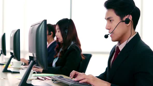 Business People Wearing Headset Working in Office