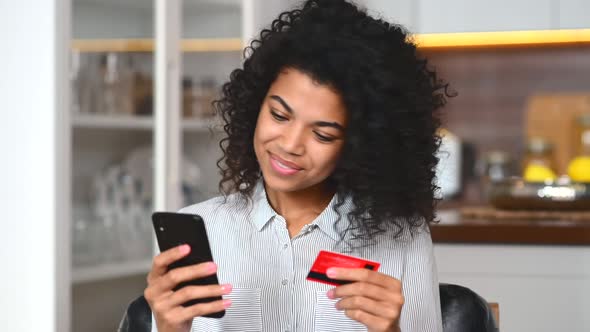 Smiling African American Teenage Girl Shopping Online