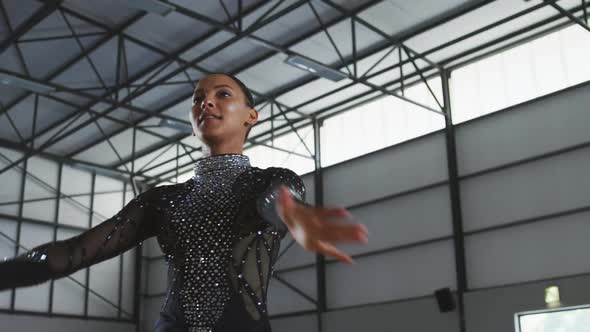 Female gymnast performing at sports hall