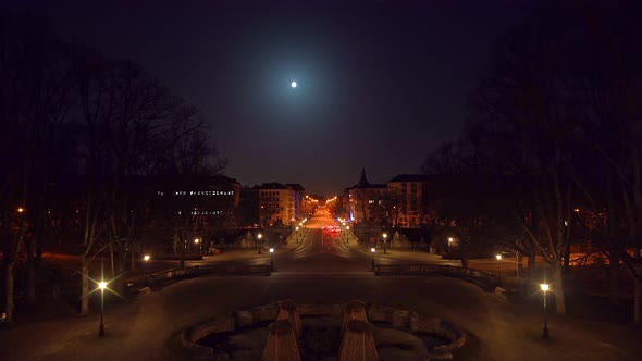 Timelapse of Munich at night, view from the Friedensengel Europaplatz at driving cars, stopping at r