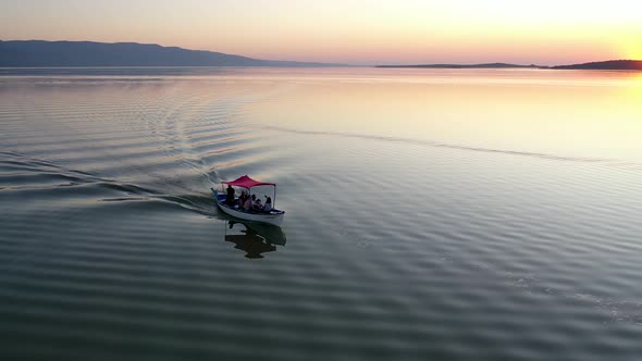 Fishing boat on lake at sunset golyazi, bursa turkey