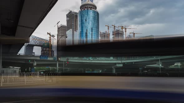 Time lapse of busy traffic and modern buildings in Beijing city , China.