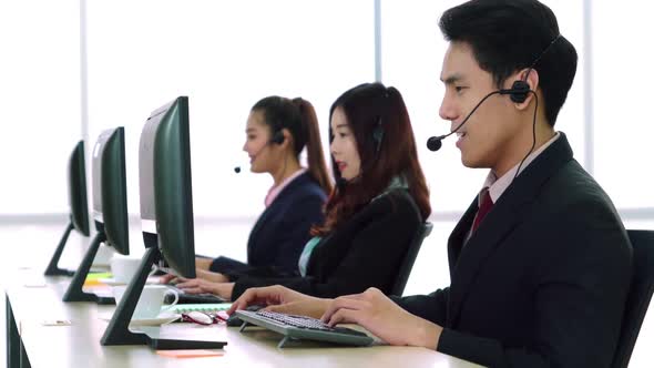 Business People Wearing Headset Working in Office