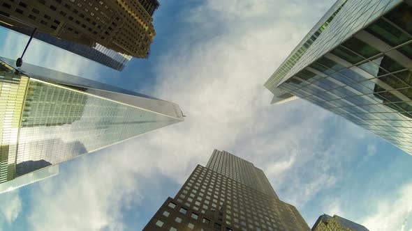 Time-lapse view of skyscrapers and clouds, bottom view