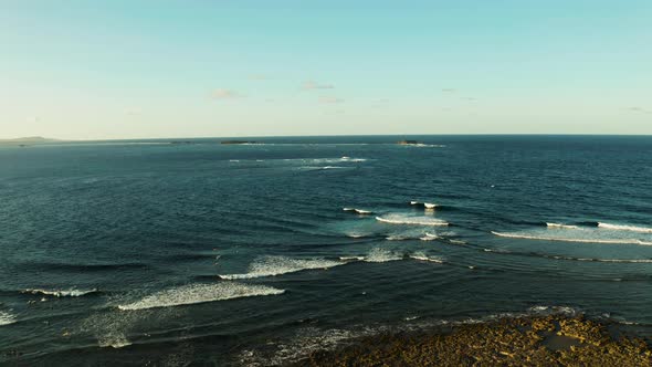 Ocean with Waves and Rocky Islands