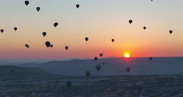 Aerial Cinematic Drone View of Colorful Hot Air Balloon Flying Over Cappadocia