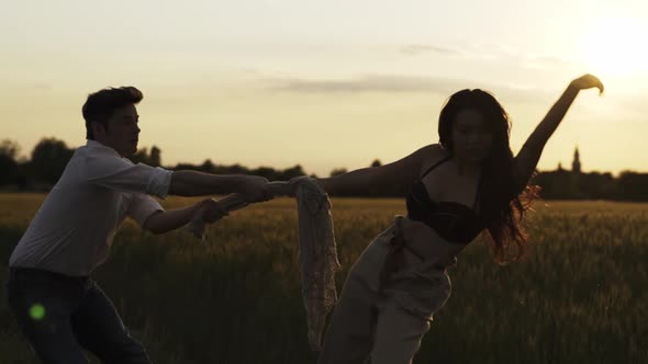 Slow motion shot of couple dancing outdoors in the evening