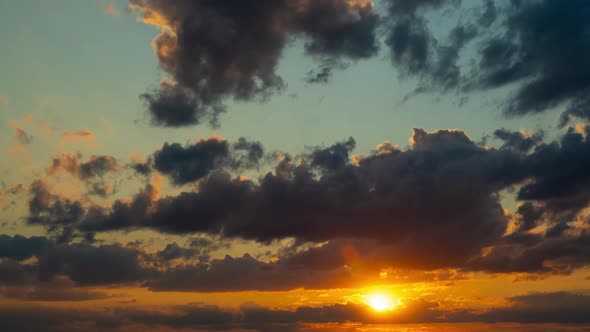 Clouds Fly Across the Sky at Sunset