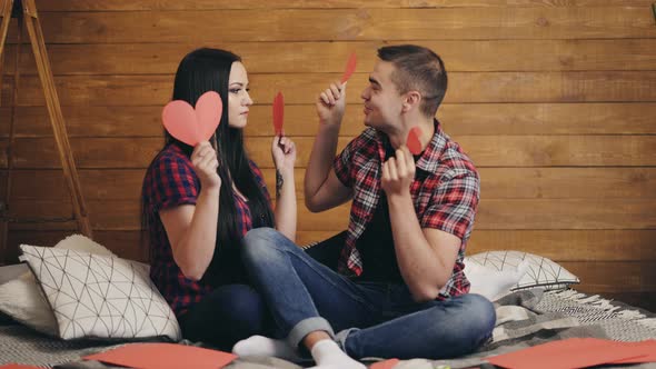 Man with his lovely girl. Happy young couple having fun at studio background