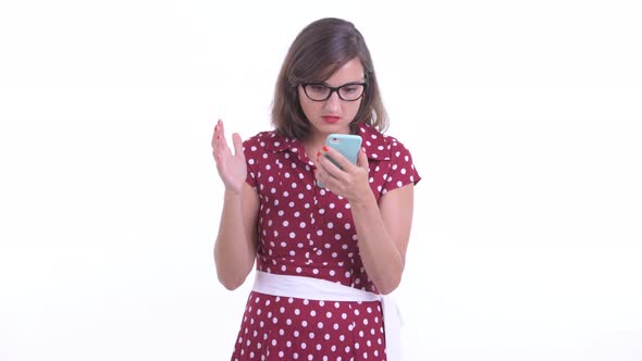 Stressed Woman with Eyeglasses Using Phone and Getting Bad News