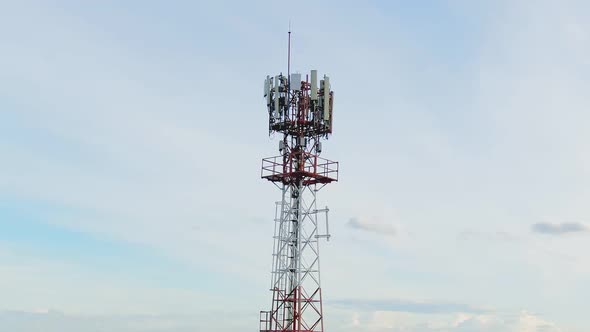 Aerial View Shot By Drone Telecommunication Base Station With  Clouds And Blue Sky.