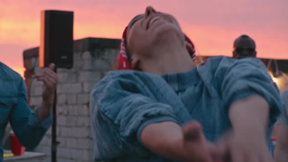 Carefree Girl Dancing at Rooftop Party