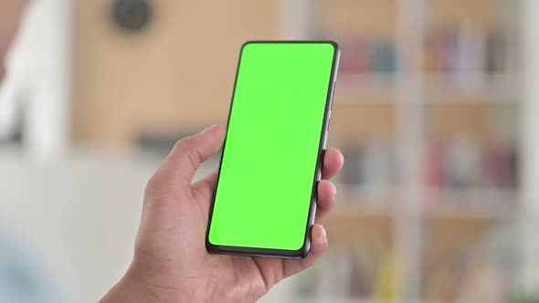 Chroma Key Rear View of Young African American Man Using Smartphone