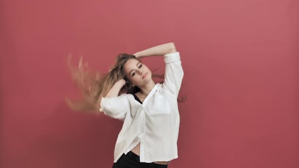 Teenage Girl Dancing and Having Fun Shakes Hair 