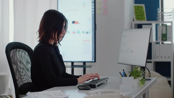 Portrait of Engineer Using Computer for Charts Design