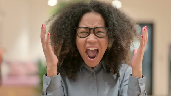 Portrait of African Businesswoman Screaming Shouting