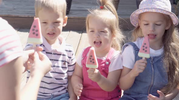 Mother Give Three Delicious Ice Cream Cone to Children