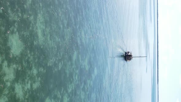 Vertical Video Boats in the Ocean Near the Coast of Zanzibar Tanzania Aerial View